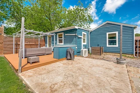 a backyard of a house with seating space