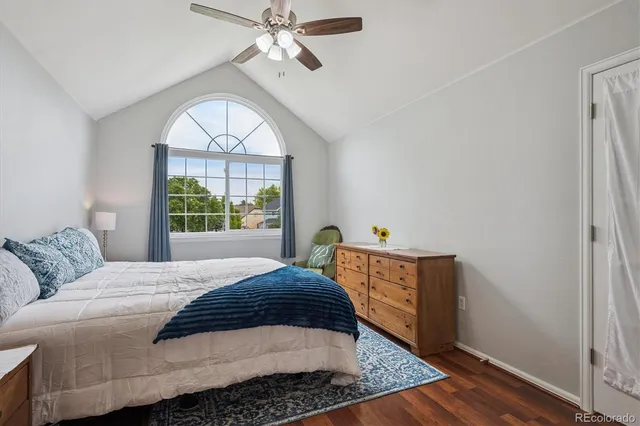 a bedroom with a bed rug and a window