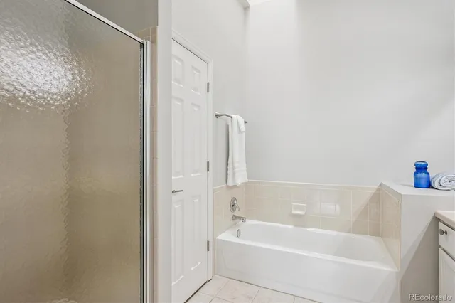 a bathroom with a bathtub and shower