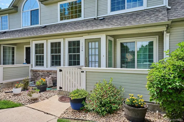 a view of a house with a potted plant