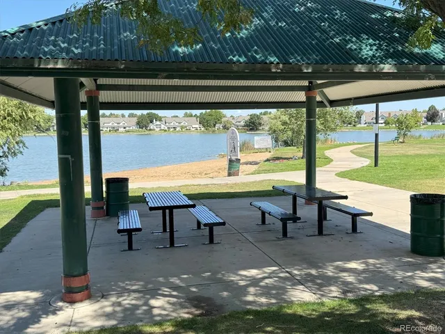 a view of a swimming pool with chairs in patio