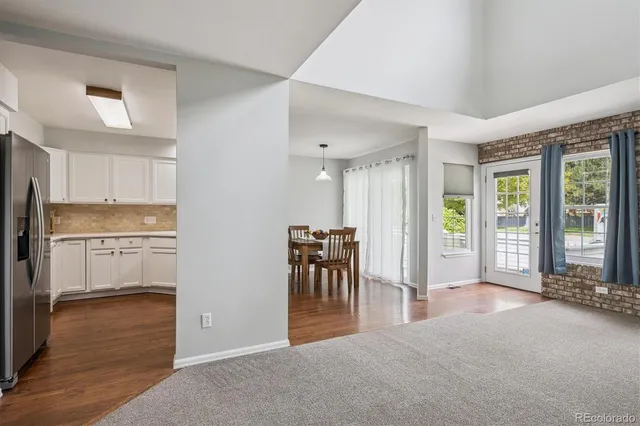 a view of a kitchen with a sink cabinets and outdoor space