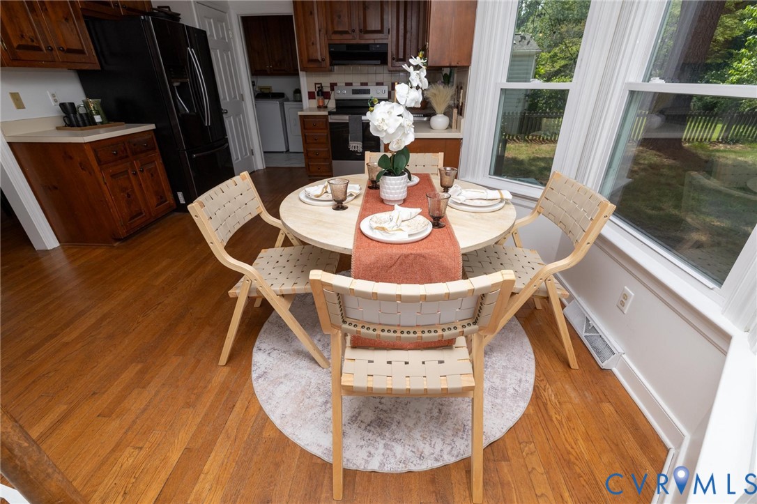 7070 Mill Valley Road Mechanicsville, VA 23111 - Photo 18 of 64 Kitchen dining area featuring wood-finish flooring