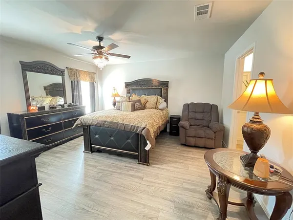 a bedroom with a bed and window