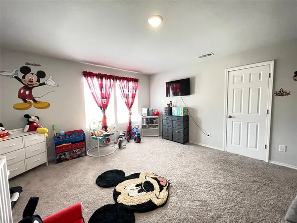 a room with furniture and a flat screen tv