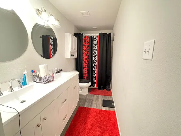 a very nice looking room with a mirror and sink