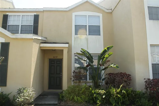 a plant in front of a house
