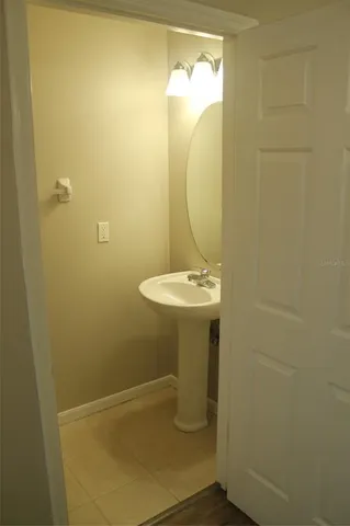 a bathroom with a sink and mirror