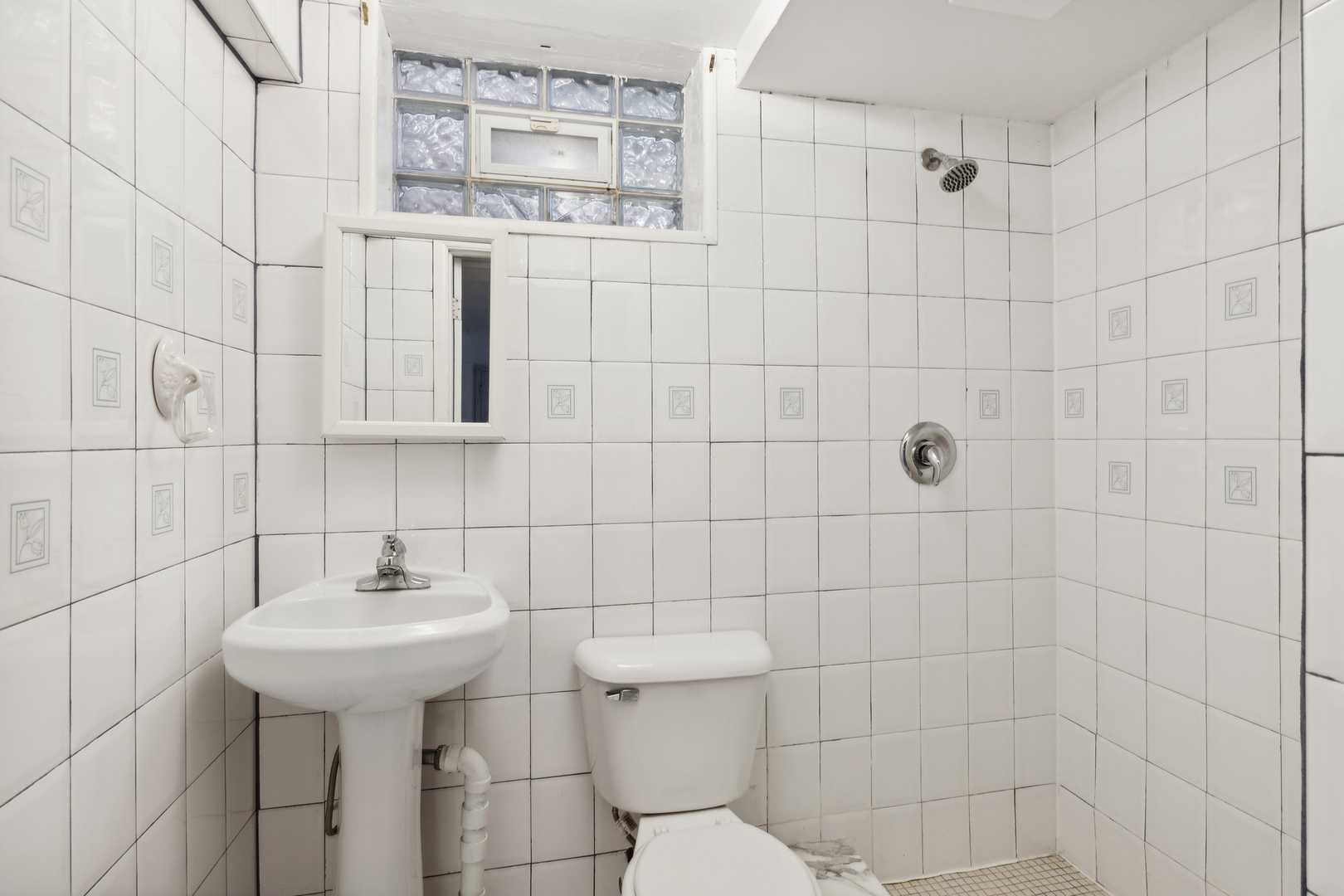 517 Romona Road Wilmette, IL 60091 - Photo 13 of 21 a bathroom with a sink toilet and shower