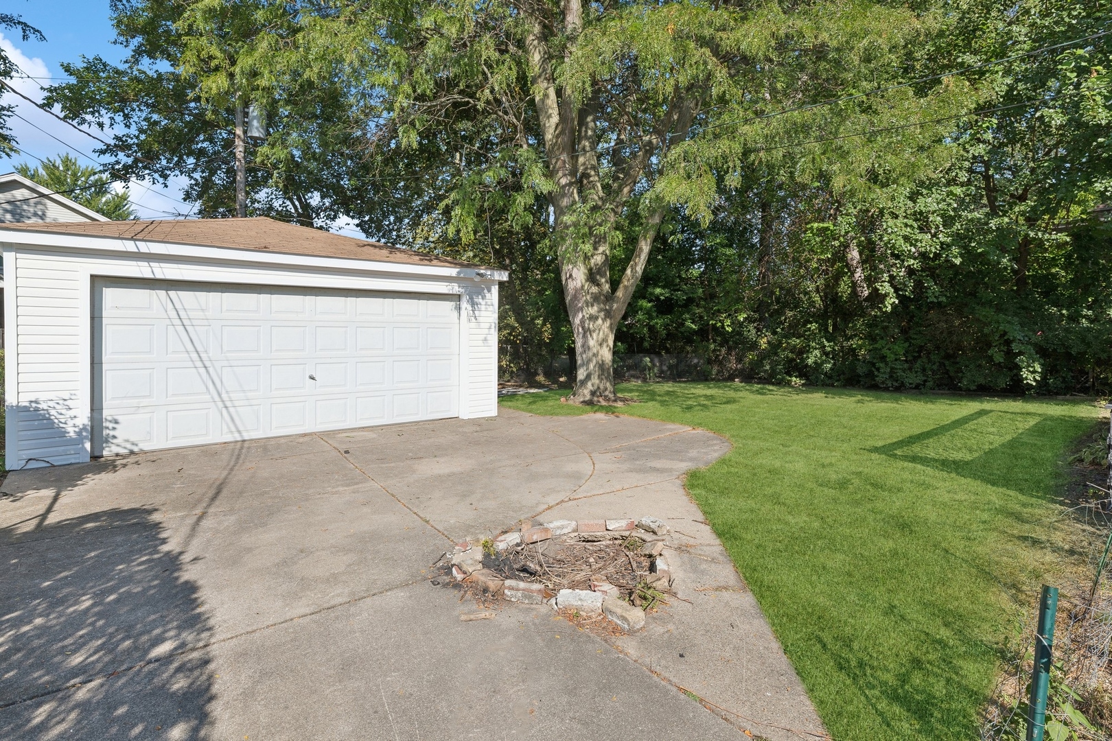 517 Romona Road Wilmette, IL 60091 - Photo 17 of 21 a view of a house with a yard and garage