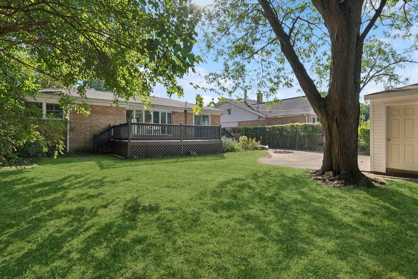 517 Romona Road Wilmette, IL 60091 - Photo 18 of 21 a view of a house with a yard