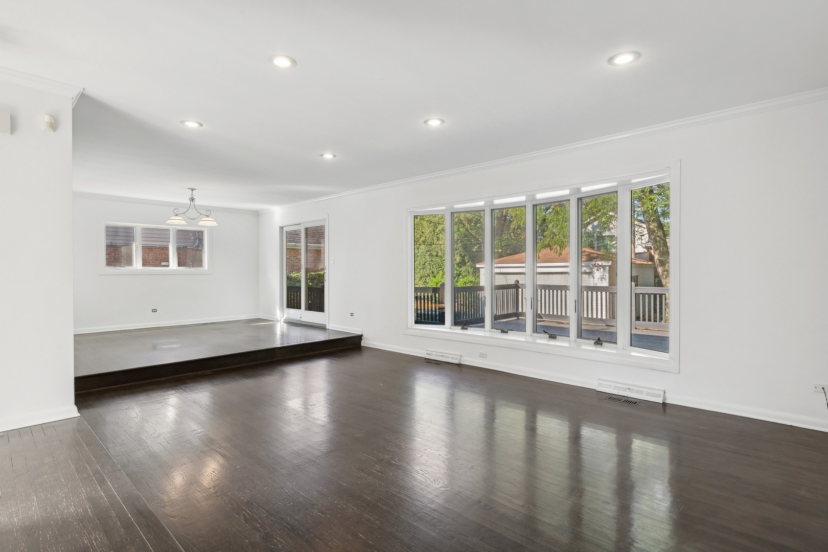 517 Romona Road Wilmette, IL 60091 - Photo 3 of 21 a view of empty room with wooden floor and windows