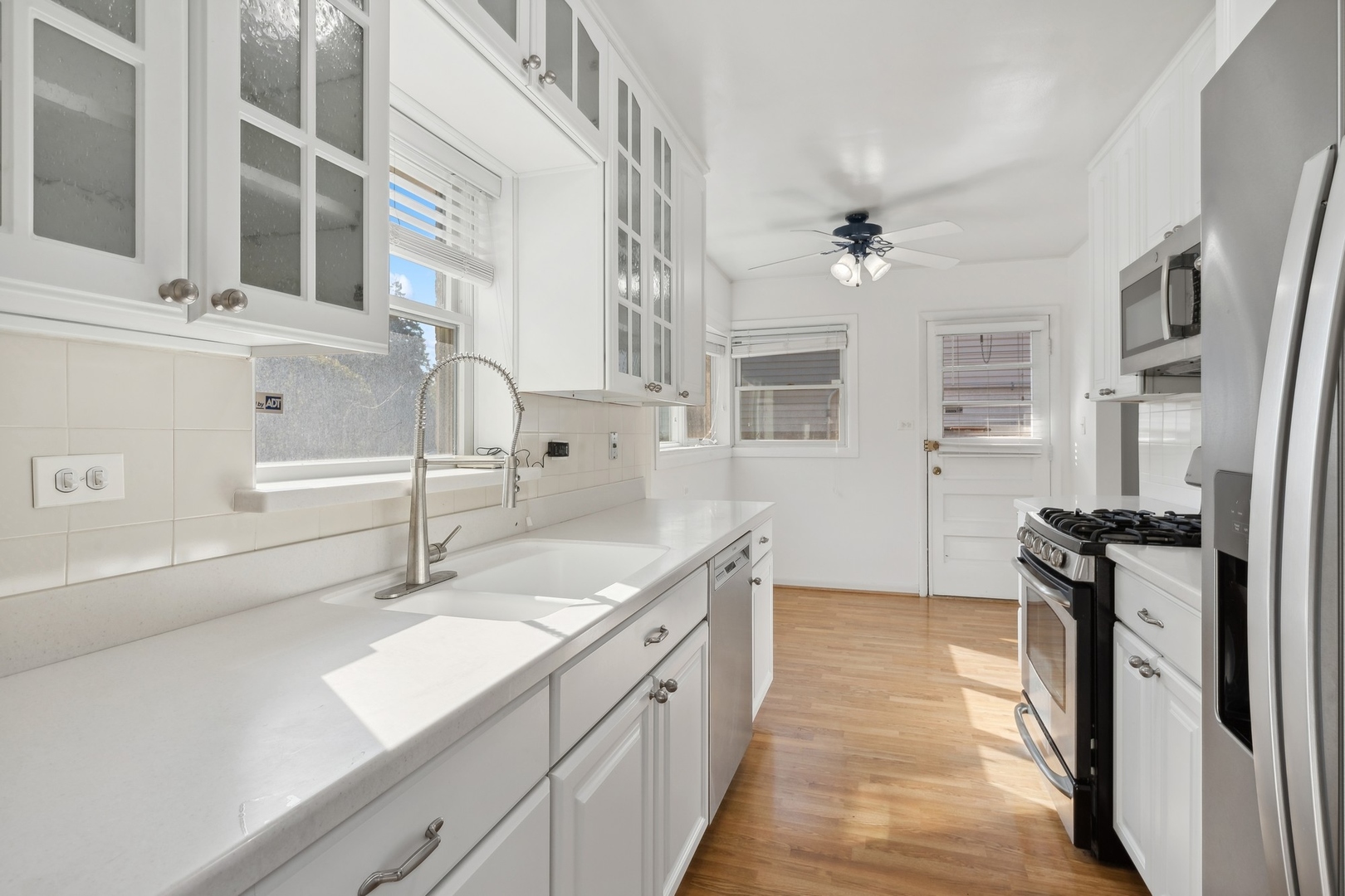 517 Romona Road Wilmette, IL 60091 - Photo 4 of 21 a kitchen with a sink appliances and cabinets