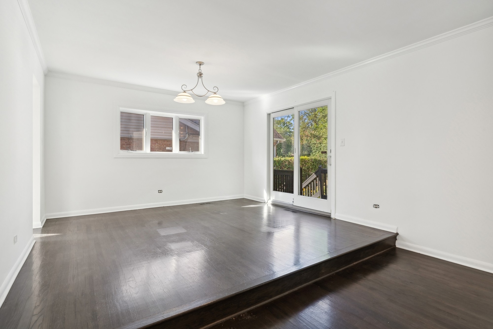 517 Romona Road Wilmette, IL 60091 - Photo 5 of 21 an empty room with wooden floor and windows