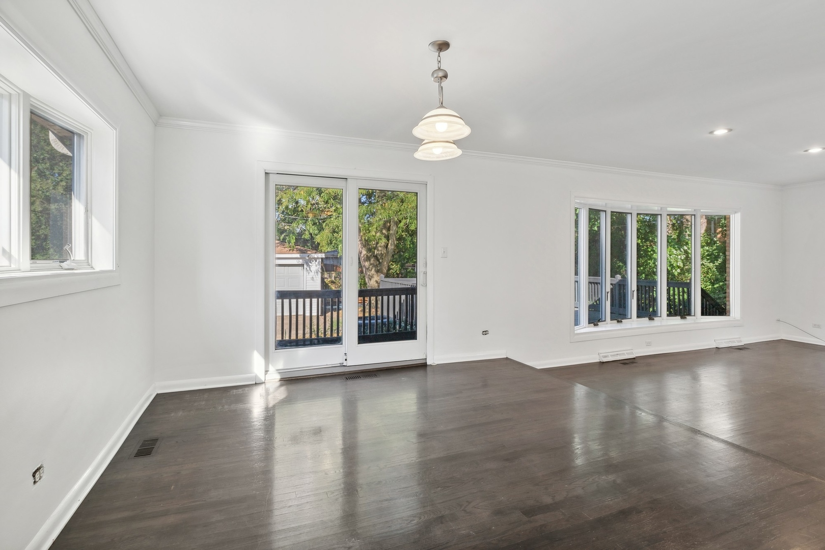 517 Romona Road Wilmette, IL 60091 - Photo 6 of 21 an empty room with wooden floor and windows