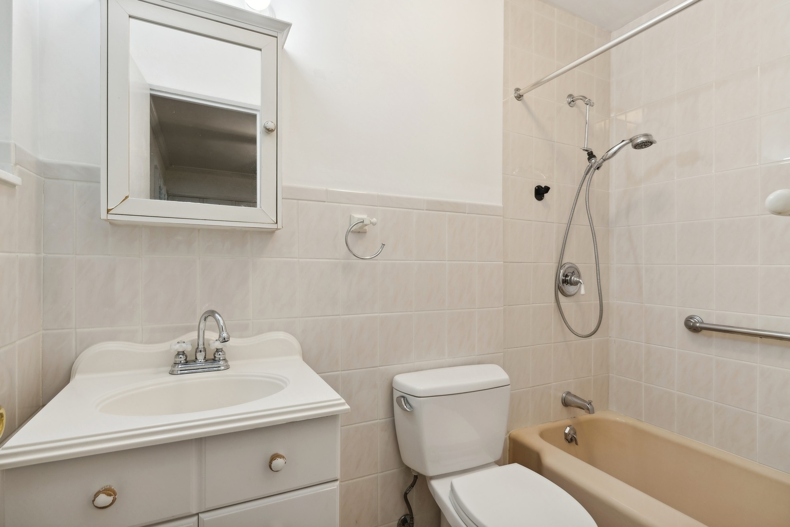 517 Romona Road Wilmette, IL 60091 - Photo 8 of 21 a bathroom with a sink toilet and shower