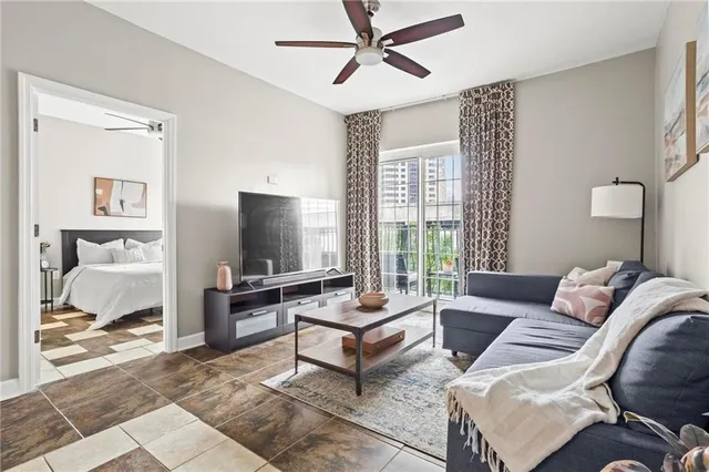 a living room with furniture and a flat screen tv