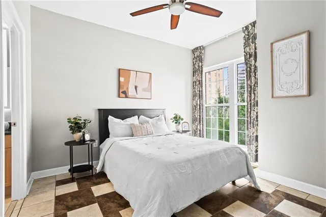 a bedroom with a bed and a window