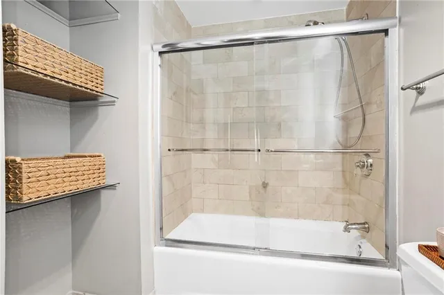 a bathroom with a bath tub and a shower