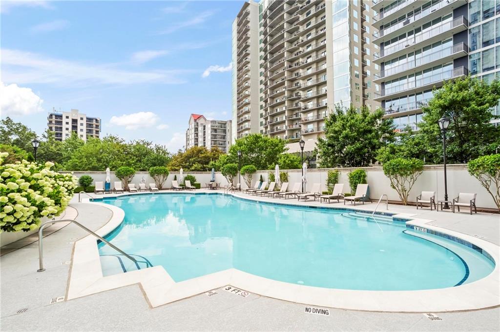 195 14th Street Northeast, Unit 604 Atlanta, GA 30309 - Photo 23 of 25 a view of a lake with a terrace