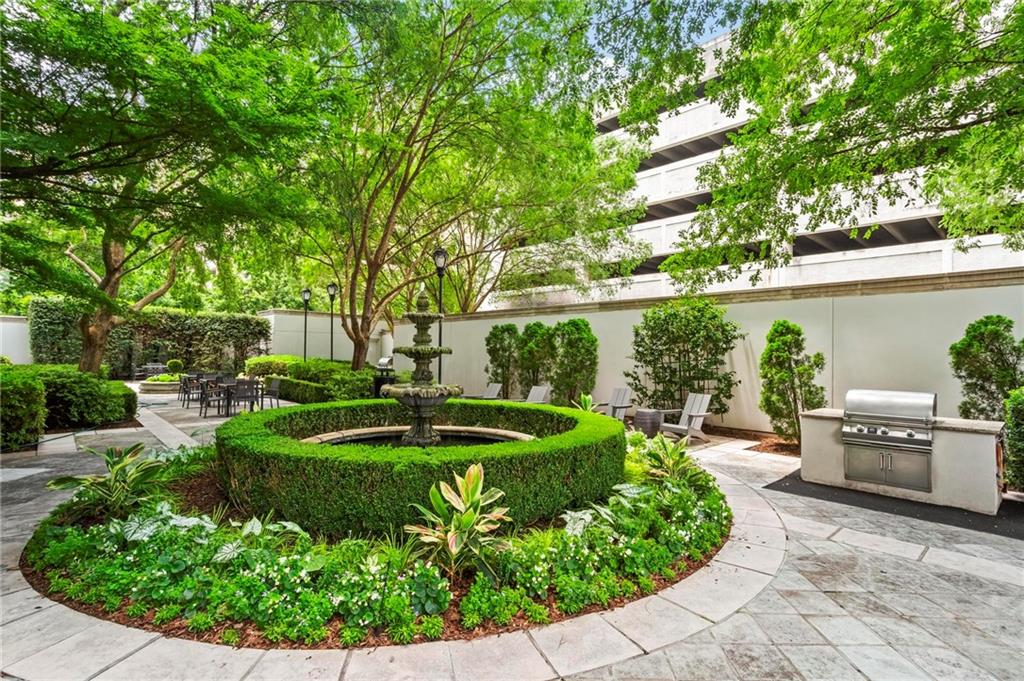 195 14th Street Northeast, Unit 604 Atlanta, GA 30309 - Photo 24 of 25 a view of a garden with a fountain