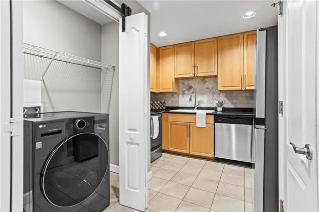 a kitchen with a washer and dryer