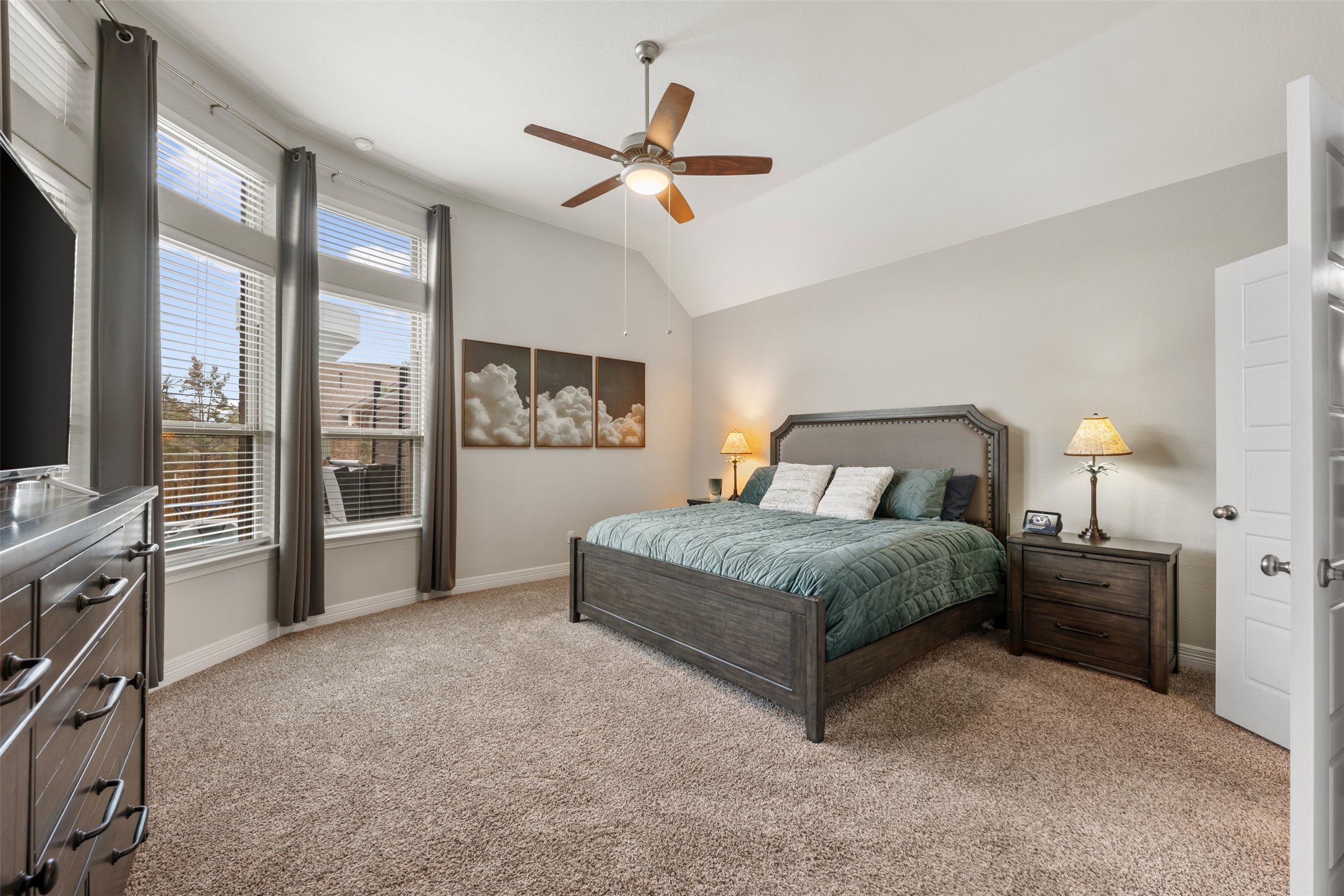 2501 Costera Street Leander, TX 78641 - Photo 13 of 40 Master suite with large windows looking out to the outdoor space.