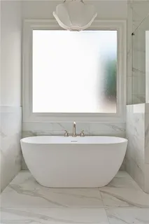 a view of a bathtub in a bathroom