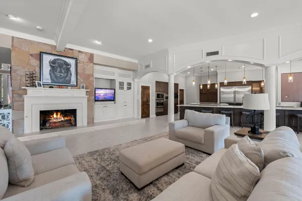 a living room with furniture rug and window