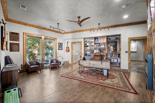 a kitchen with granite countertop cabinets and refrigerator