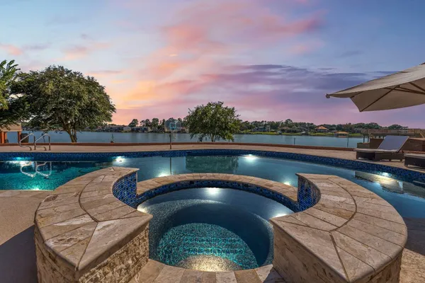 a view of a swimming pool and lounge chair