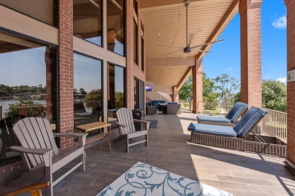 a view of a patio with table and chairs in the patio