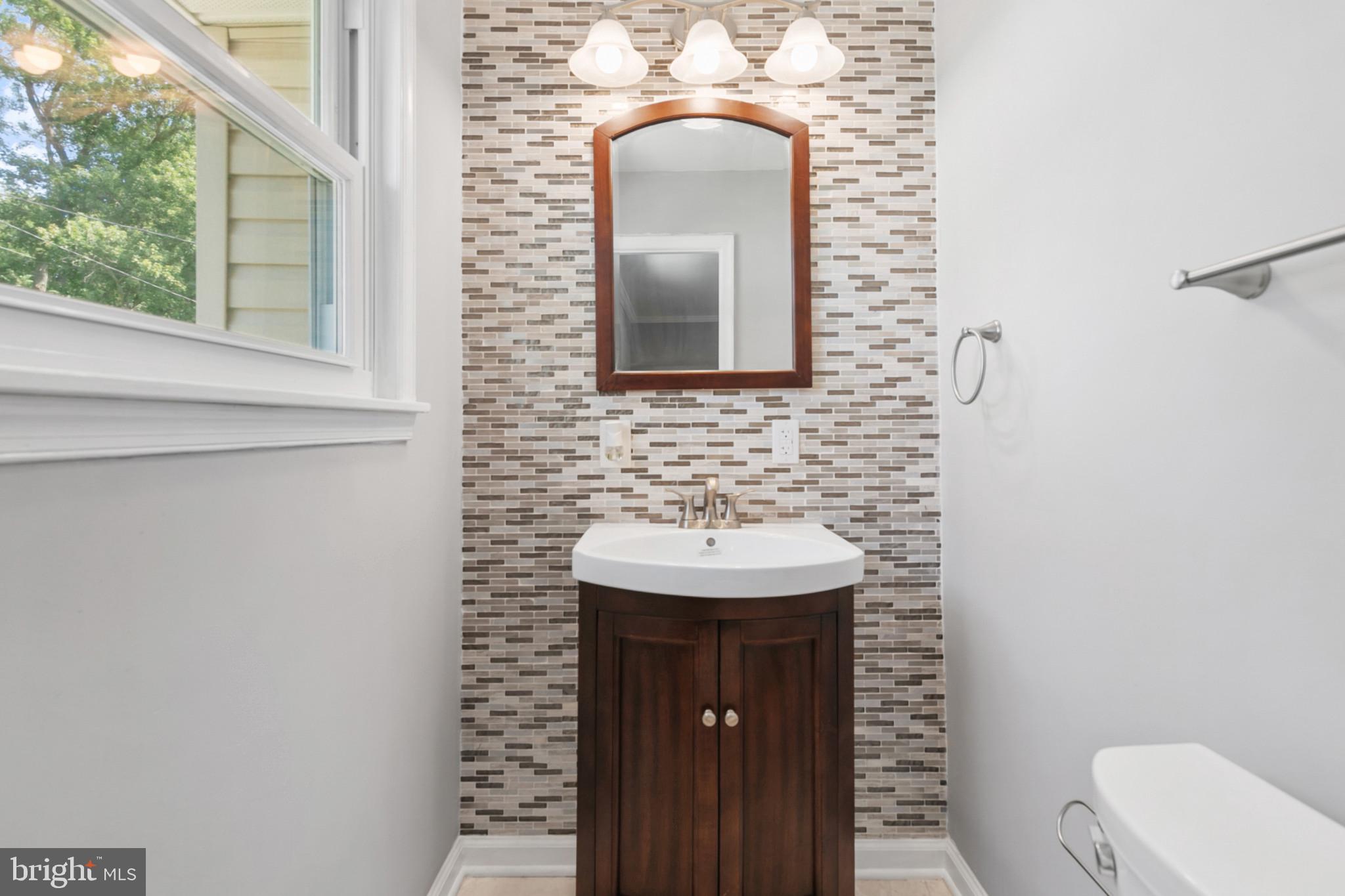 400 Bryanstone Road Owings Mills, MD 21117 - Photo 14 of 35 Primary half bath redone 2024, has marble tile flr