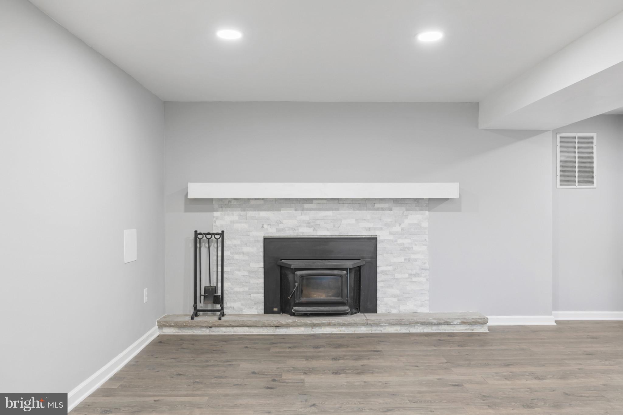 400 Bryanstone Road Owings Mills, MD 21117 - Photo 20 of 35 Fam rm has wood stove insert w/new stone surround