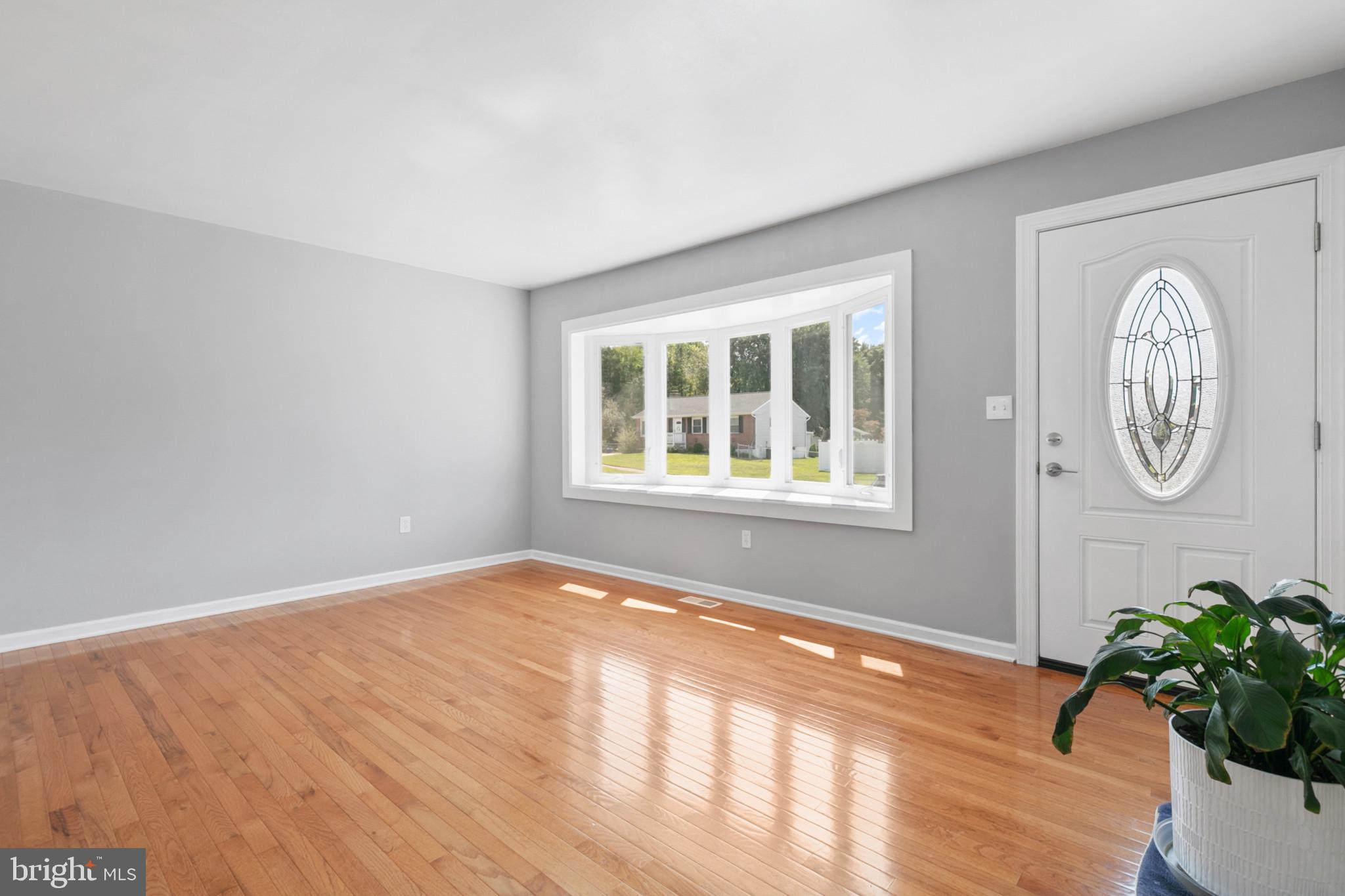 400 Bryanstone Road Owings Mills, MD 21117 - Photo 2 of 35 Living room is 17 x 12 and has new hardwood floor