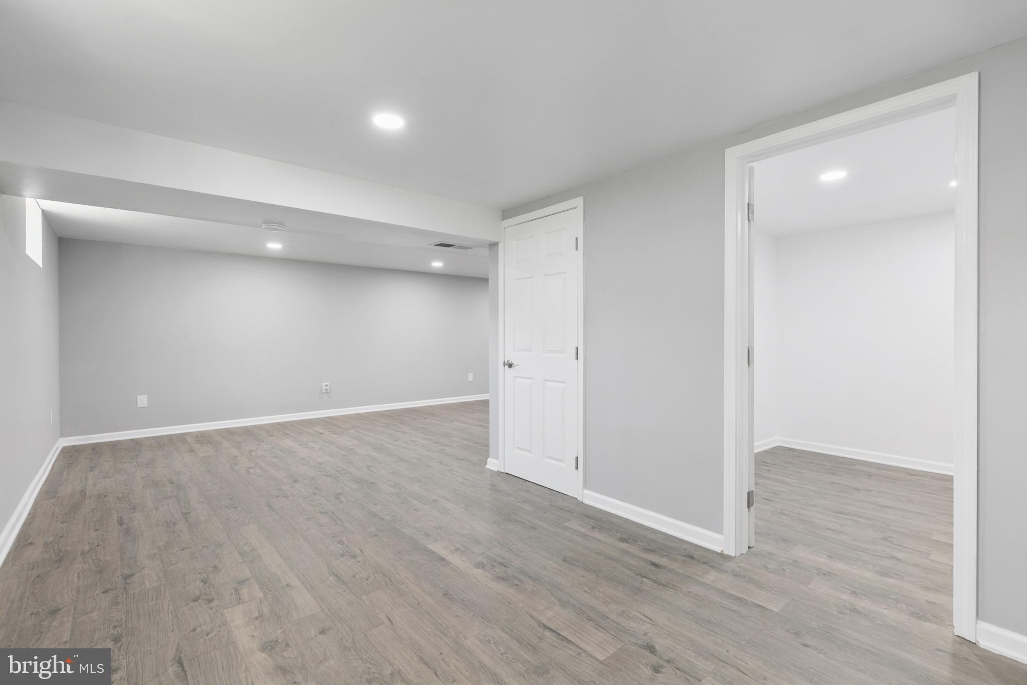 400 Bryanstone Road Owings Mills, MD 21117 - Photo 22 of 35 Rec Room area is 12x9, new LVP floor, fresh paint