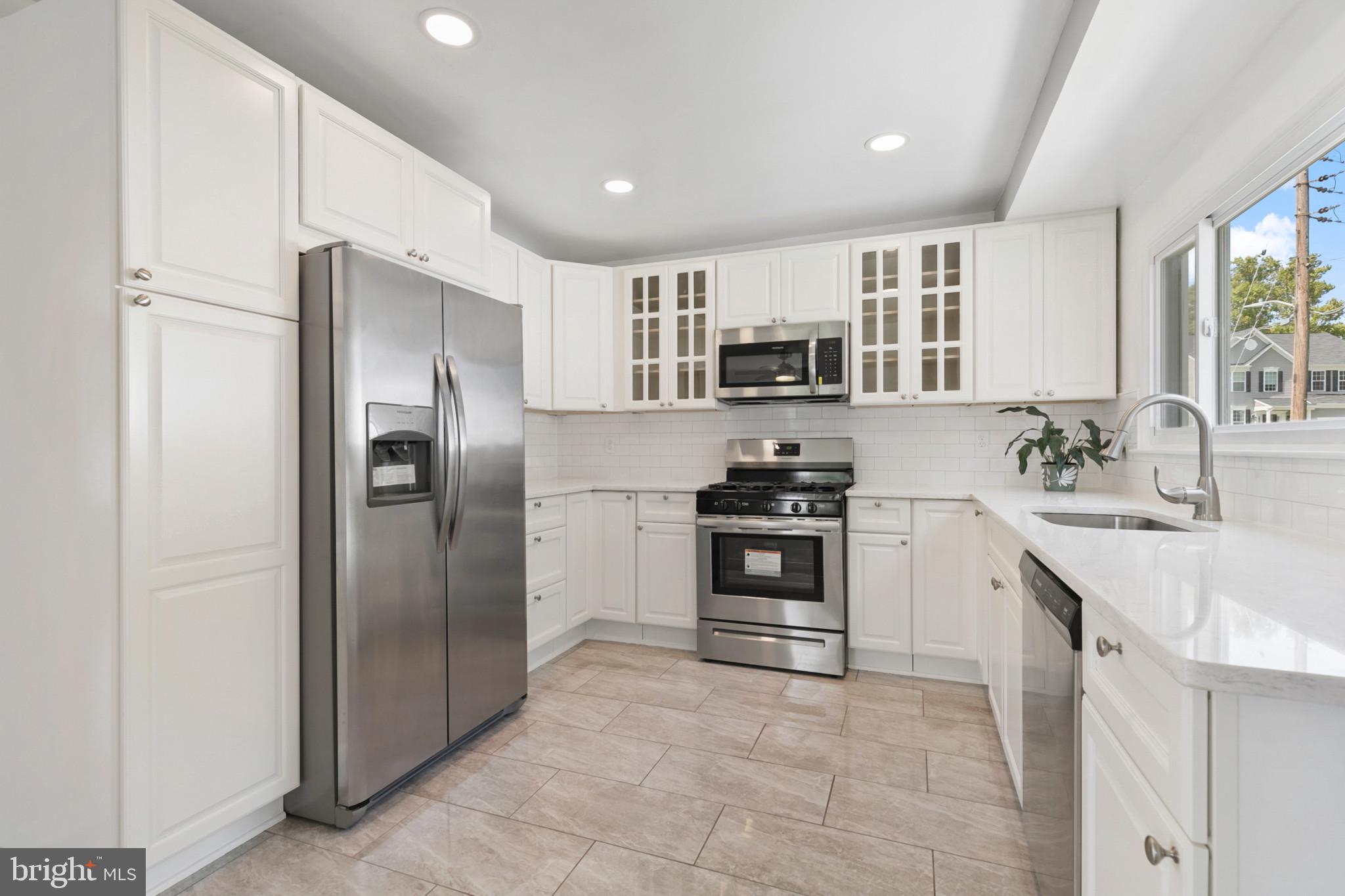 400 Bryanstone Road Owings Mills, MD 21117 - Photo 8 of 35 Kitchen redone 2024, ceramic tile & ss appliances