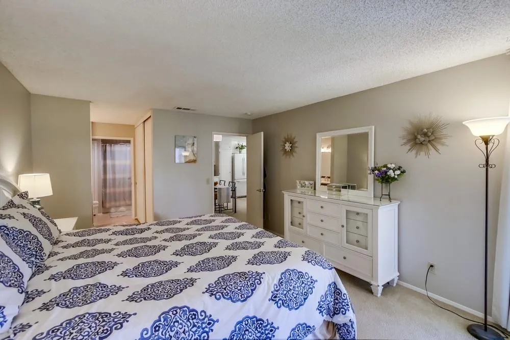 17617 Pomerado Road, Unit 215 San Diego, CA 92128 - Photo 13 of 50 a bedroom with a bed and a dresser