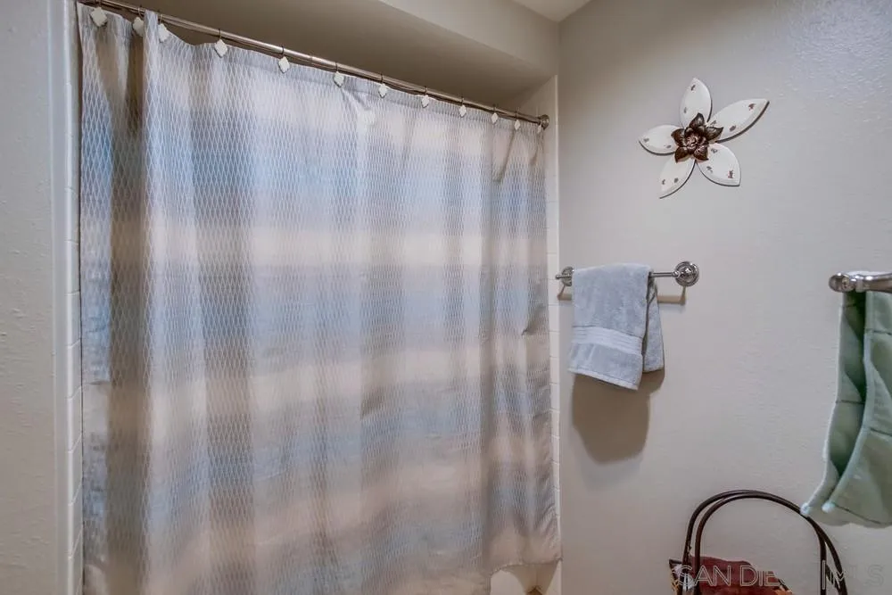 17617 Pomerado Road, Unit 215 San Diego, CA 92128 - Photo 15 of 50 a bathroom with a shower curtain