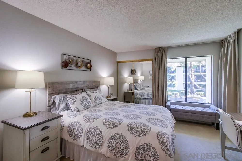 17617 Pomerado Road, Unit 215 San Diego, CA 92128 - Photo 16 of 50 a bedroom with a bed and a window