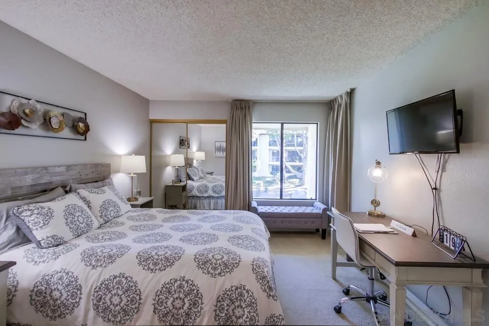 17617 Pomerado Road, Unit 215 San Diego, CA 92128 - Photo 17 of 50 a bedroom with a bed and large windows