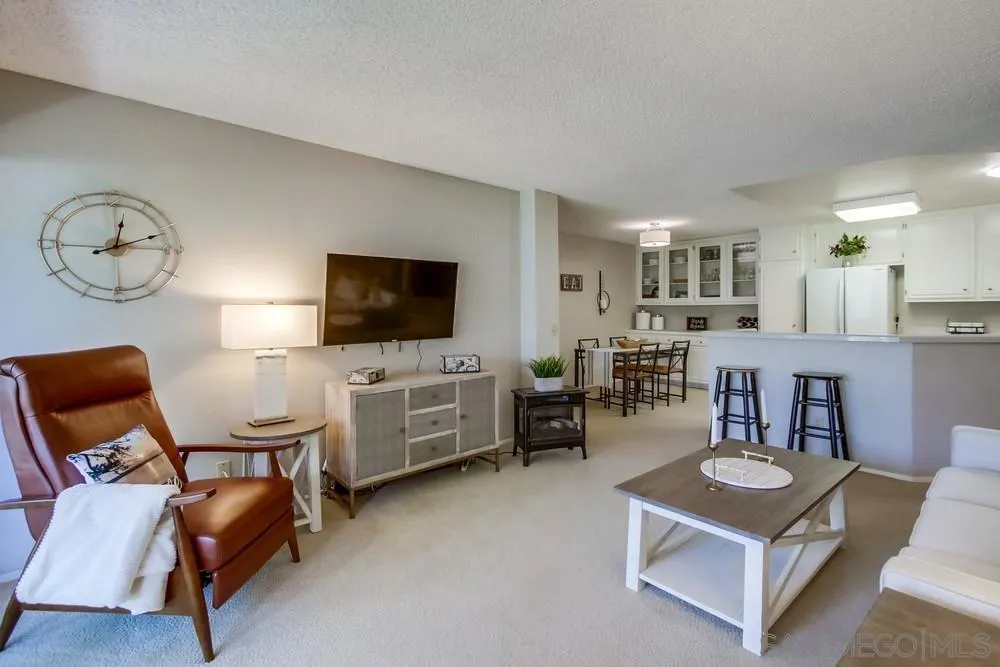 17617 Pomerado Road, Unit 215 San Diego, CA 92128 - Photo 2 of 50 a living room with furniture and a flat screen tv