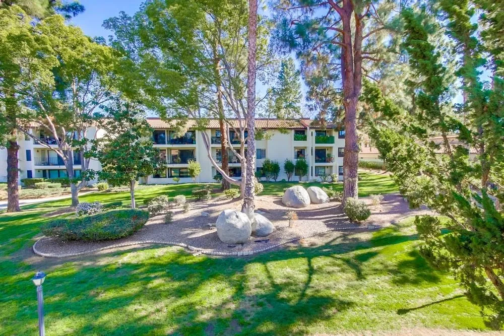 17617 Pomerado Road, Unit 215 San Diego, CA 92128 - Photo 35 of 50 a view of backyard with a table and chairs and potted plants