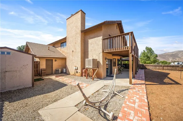 a patio with table and chairs