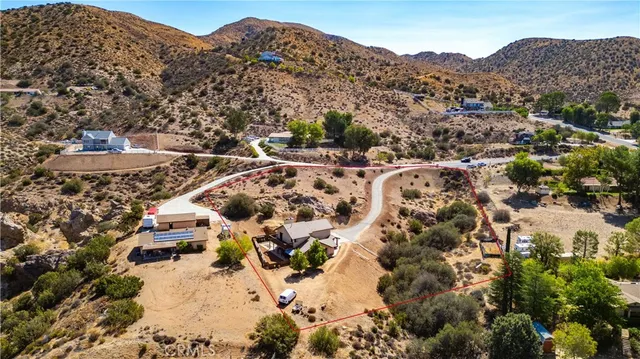 an aerial view of residential house with swimming pool