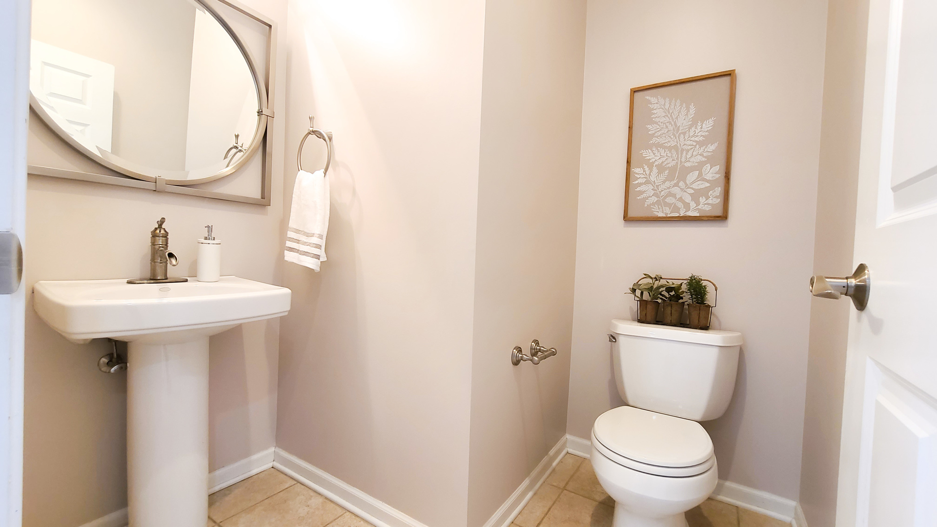 352 West Seminary Avenue, Unit 504 Wheaton, IL 60187 - Photo 13 of 24 a bathroom with a toilet sink and mirror