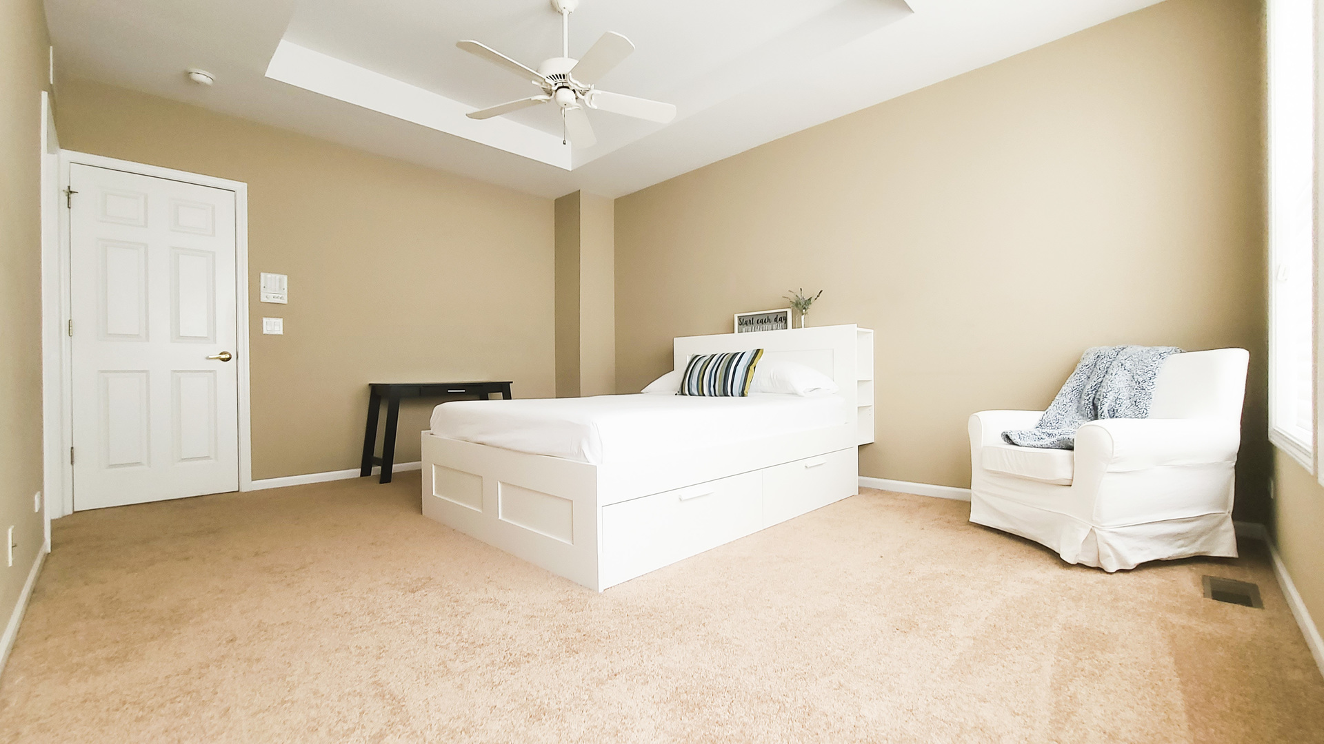352 West Seminary Avenue, Unit 504 Wheaton, IL 60187 - Photo 15 of 24 a bedroom with a white bed and a couch