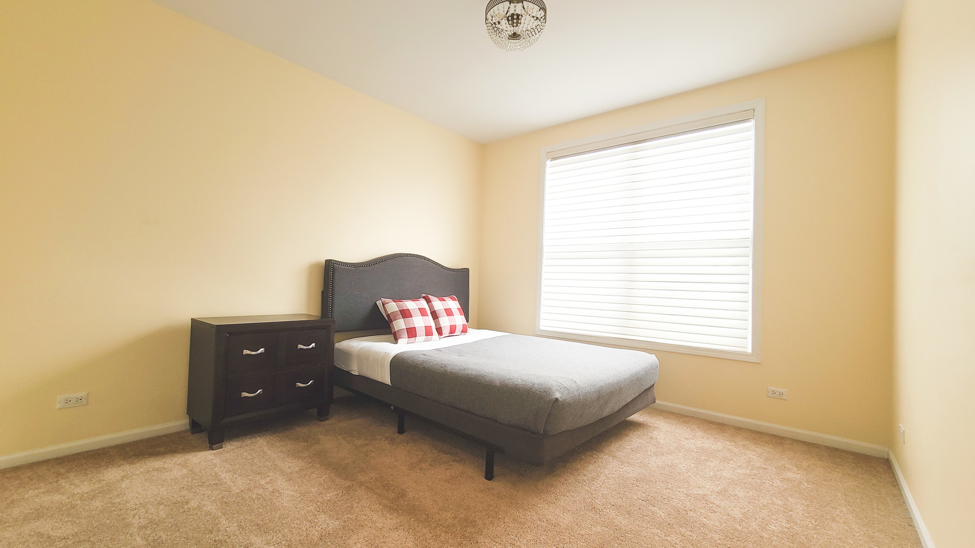352 West Seminary Avenue, Unit 504 Wheaton, IL 60187 - Photo 18 of 24 a bedroom with a bed and window
