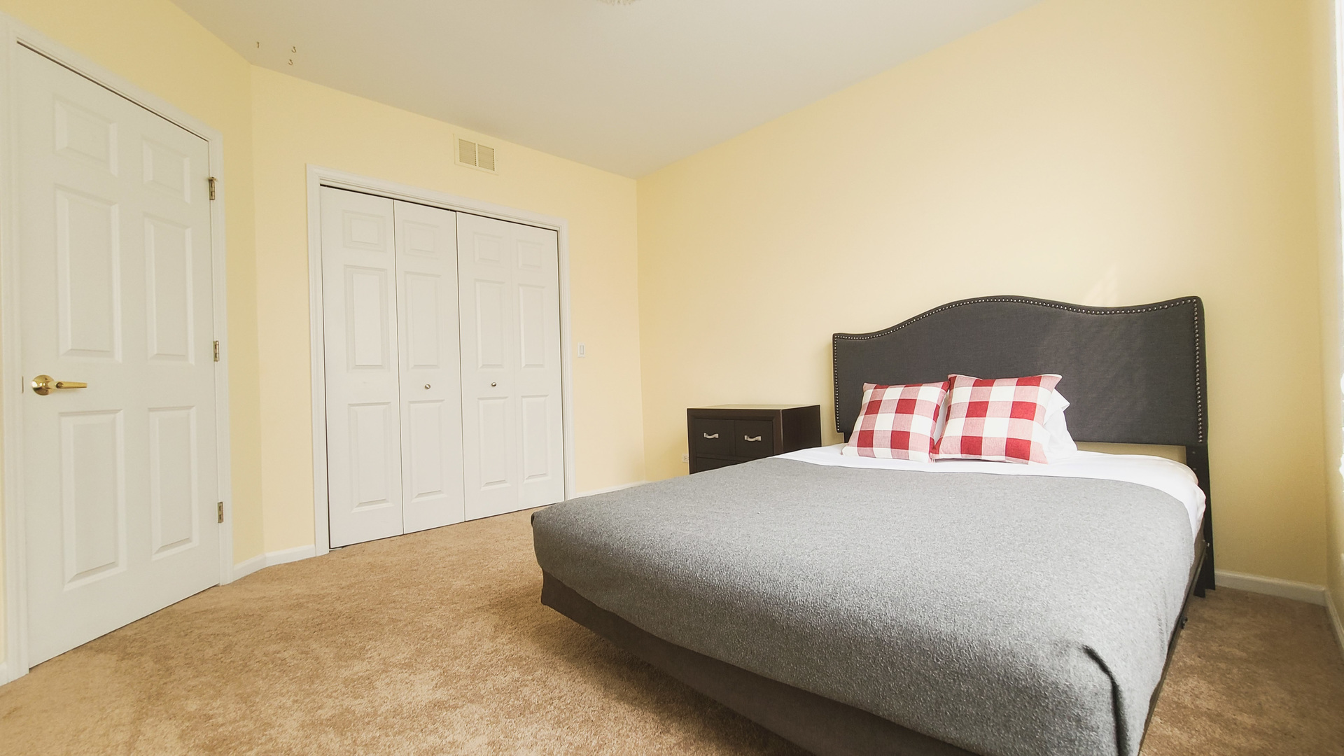 352 West Seminary Avenue, Unit 504 Wheaton, IL 60187 - Photo 19 of 24 a bedroom with a bed and a painting on the wall