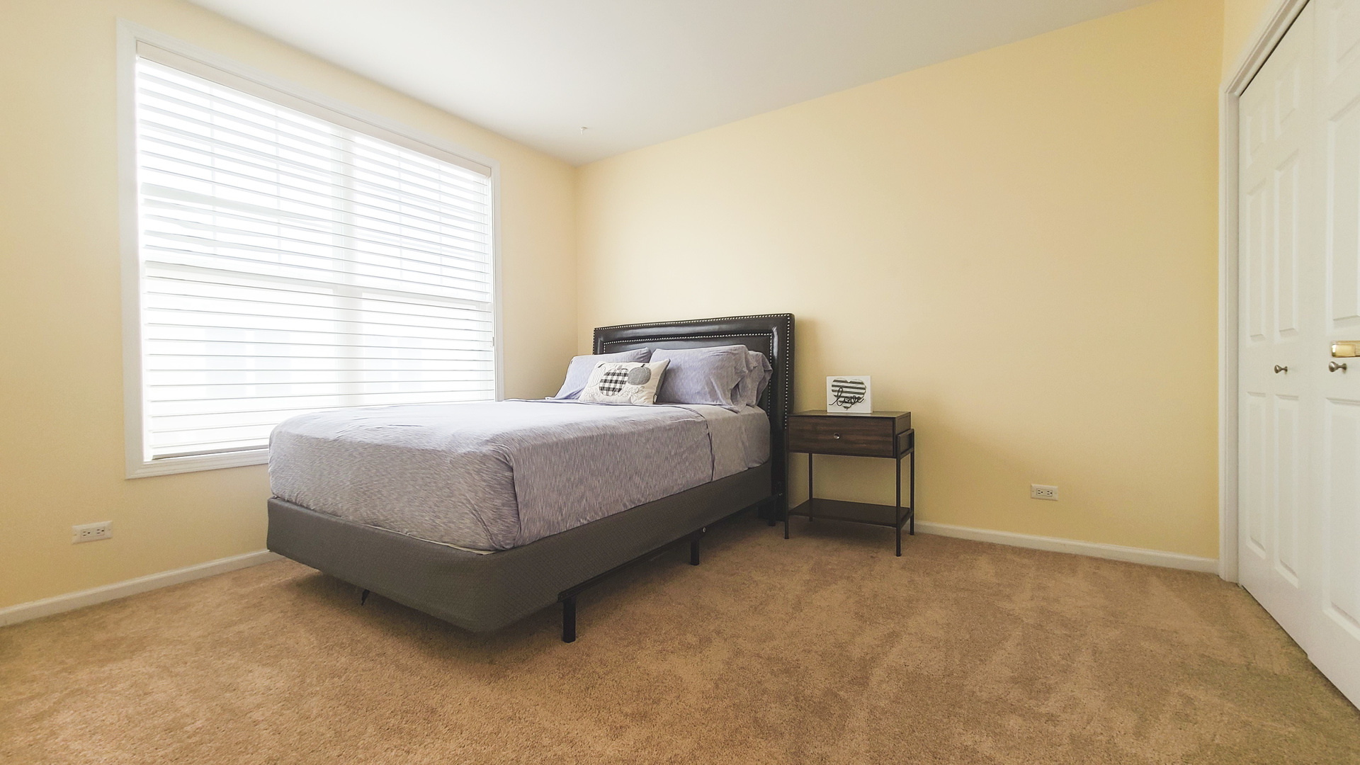 352 West Seminary Avenue, Unit 504 Wheaton, IL 60187 - Photo 20 of 24 a bedroom with a bed and a window